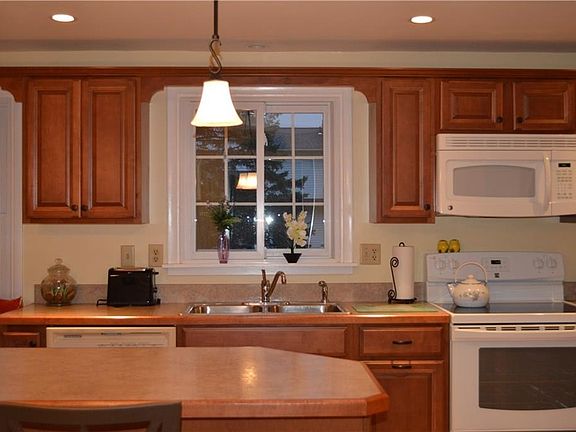 Kitchen is well lit with recessed lighting with dimmers and a great view overlooking the back yard.