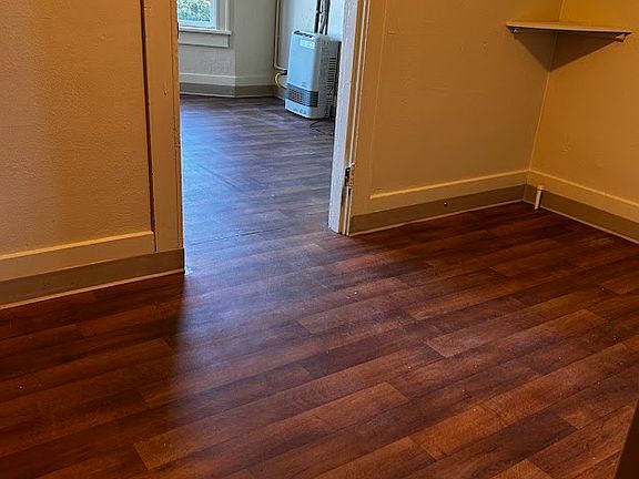 Doorway from smaller room into large living area.