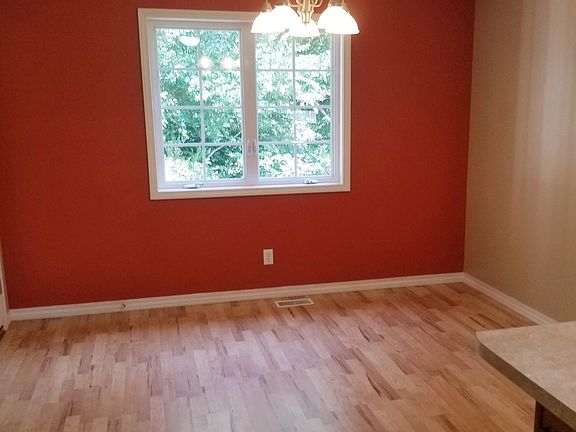 Dining area overlooking wooded area.