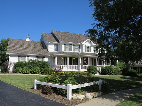 Hardwood cedar wraparound porch with beadboard ceiling detail, a wonderful place to relax.