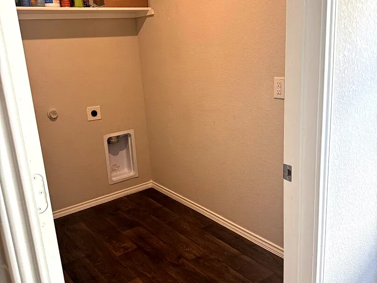 Dedicated laundry area for convenience and functionality.