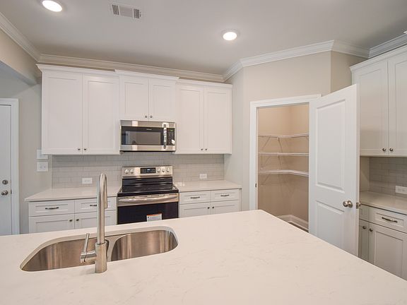 Kitchen with Walk-In Pantry - Upgraded Cabinet Height