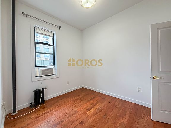 5th image of 228 E 10th St APT 4