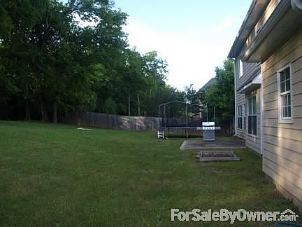 Large wood-fenced backyard