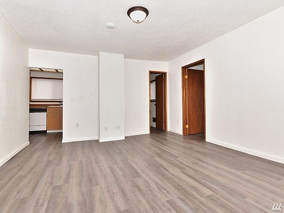 Stepping in your front door with 1st bedroom on left, your kitchen straight ahead, full bath to right of kitchen and  2nd bedroom on the left. New flooring through-out 