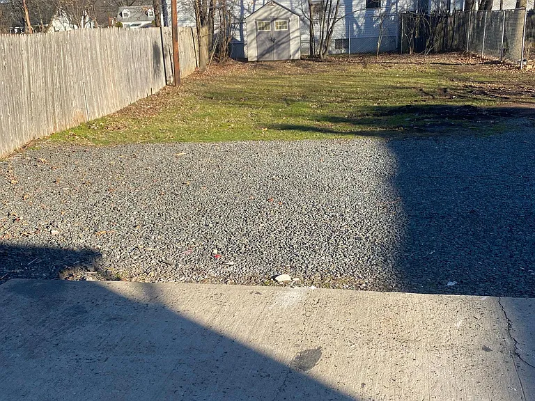 backyard/cement patio/parking, fenced back/shed
Parking for 4 cars