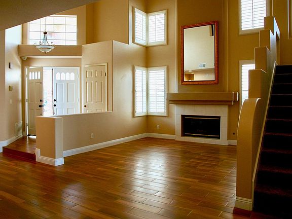 Living Room - high ceiling with fireplace and ample lighting