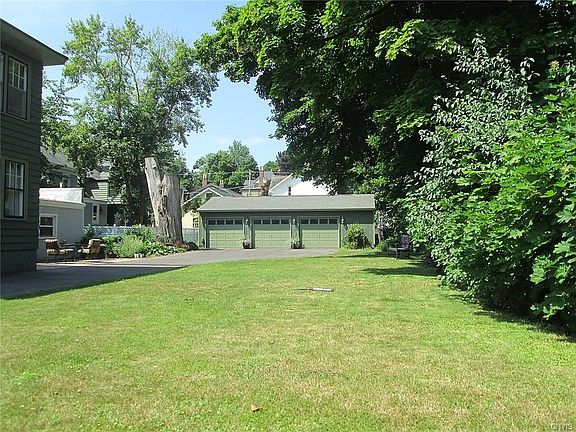 Nice side yard is tastefully landscaped offering plenty of privacy.