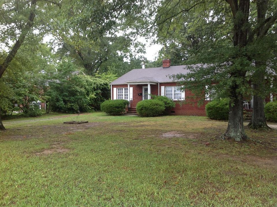 Big front yard with shady tree canopy