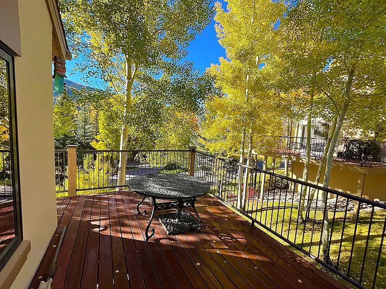 Large wrap around deck with sweeping east-west mountain views