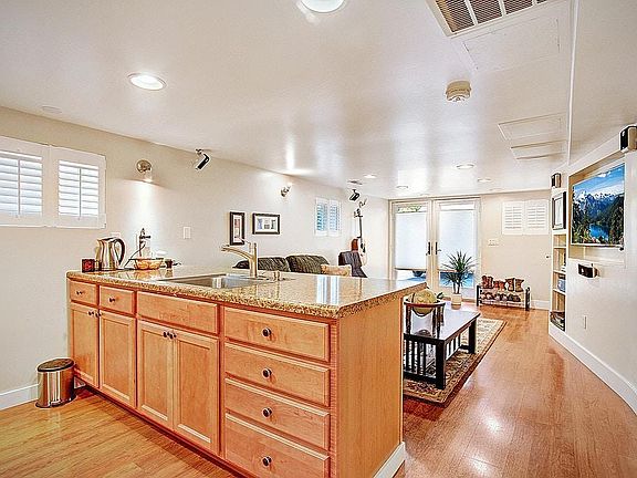 View of the kitchen island and living room from corner of the kitchen