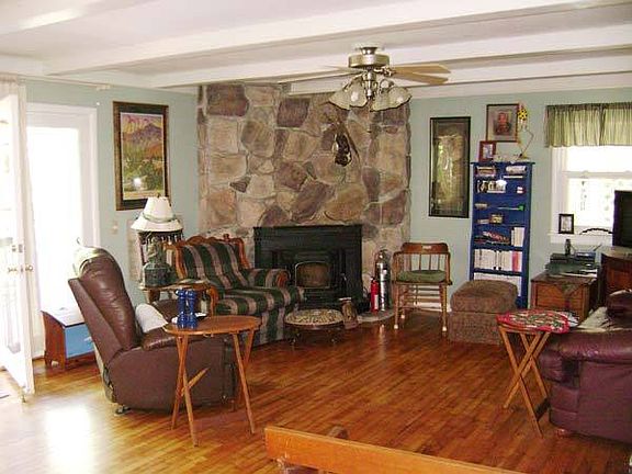 Living Room
						:
						Living room with wood floors and a fireplace