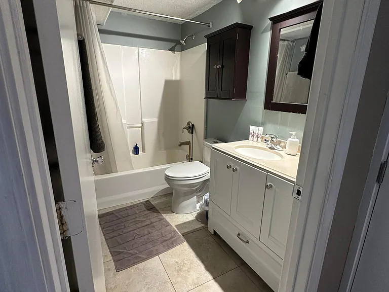 Modern, updated bathroom with ample storage.