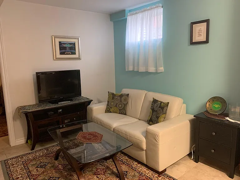 Recreation Area attached to kitchen. In addition, there is another area for dining. The furniture is just to provide an idea of space. This area is unfurnished.