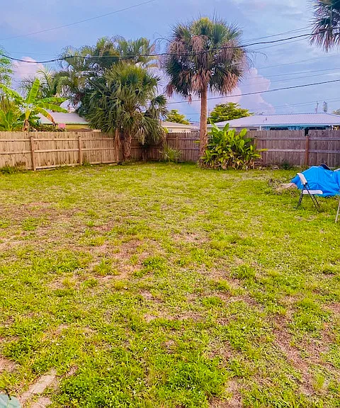 Large Fenced-in Backyard with Fire Ring and Gates on each side of the House.