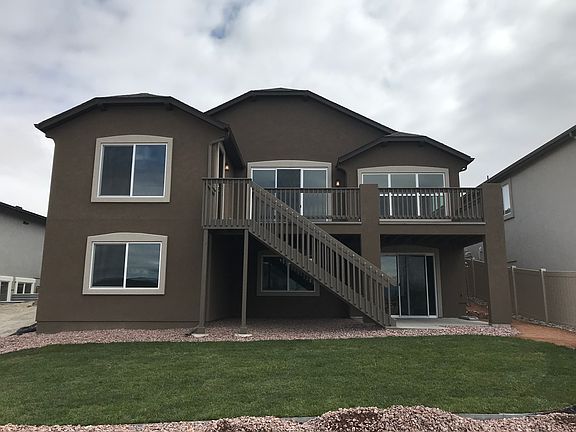 Exterior rear on walk-out site. Photo representing home to be built and may demonstrate optional fe