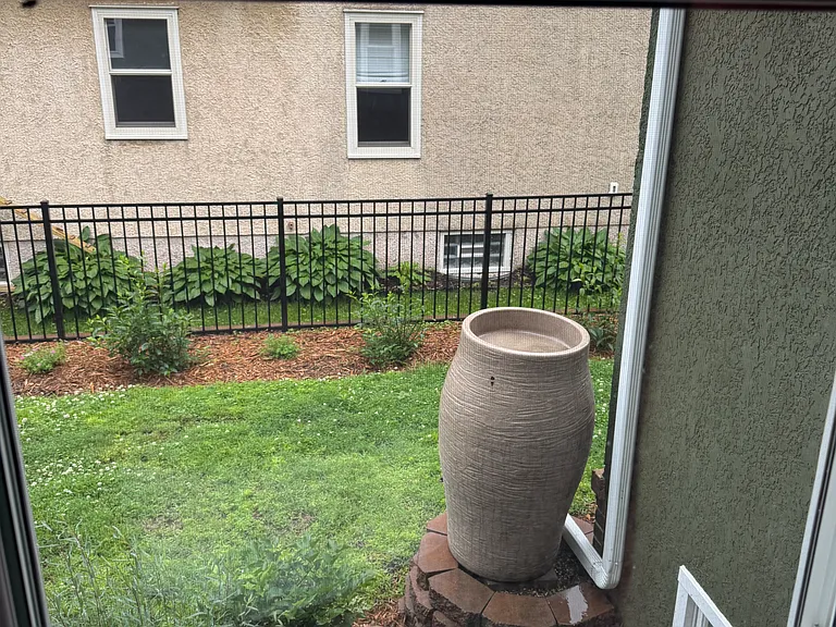 view from dining room with rain barrel