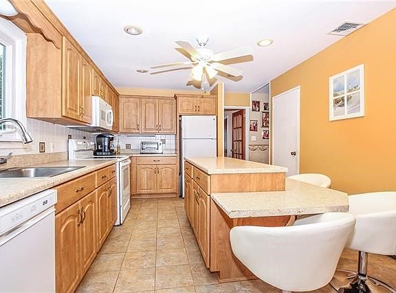 Kitchen with abundance of counter space and eating area