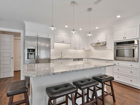 Kitchen with island and breakfast bar