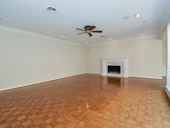 24'x19' is the measurement of the living area. The recessed lighting, surround sound, ice glass fireplace and parquet floors is the point of interest in this photo. I will bring you back to this area as we progress past the special points of interest