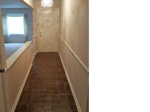 Entry way with darling vintage light fixture