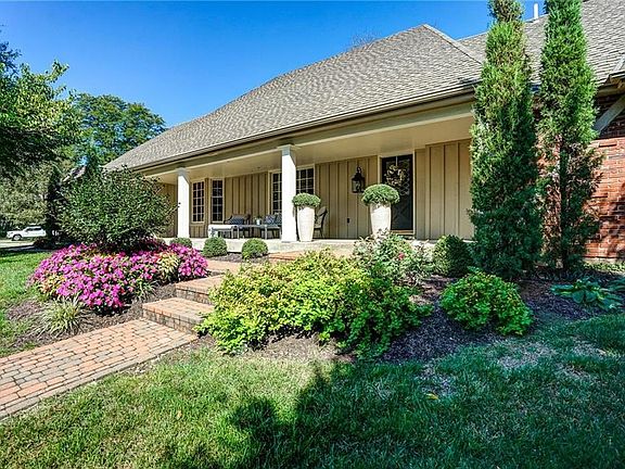 Extensive landscaping throughout lawn plus new sprinkler system in yard and landscape beds.