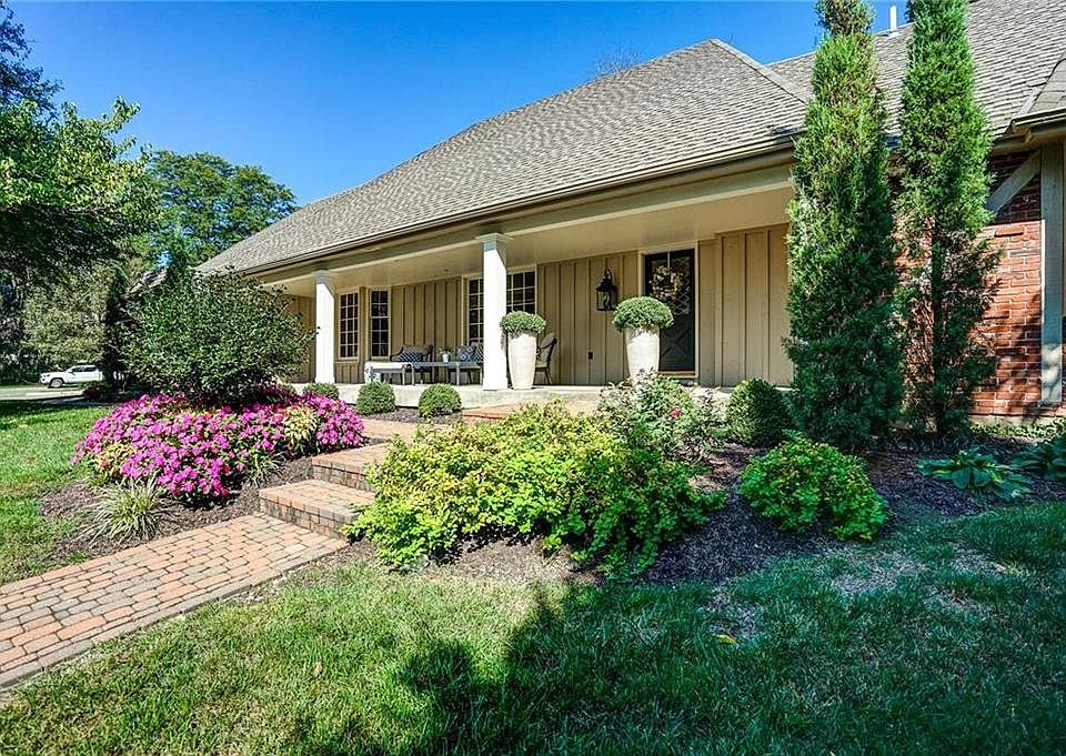 Extensive landscaping throughout lawn plus new sprinkler system in yard and landscape beds.
