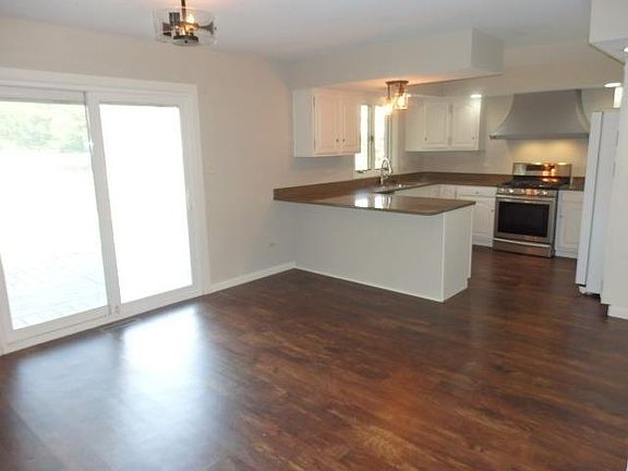Kitchen and Dining Room with Slider to Back Deck