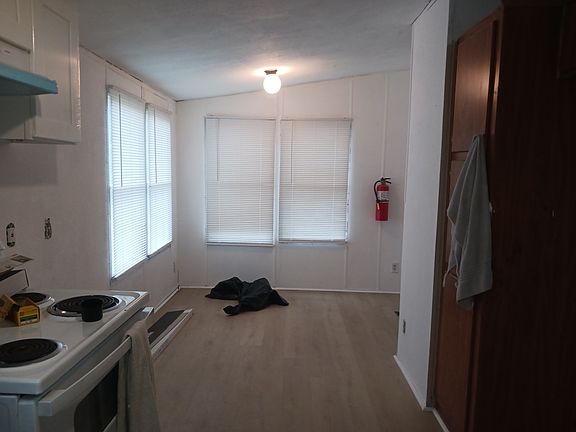 View from kitchen into breakfast area.