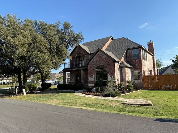 This 3/2.5/2 home sits on 1/3 acre across the street from Lake Lewisville
