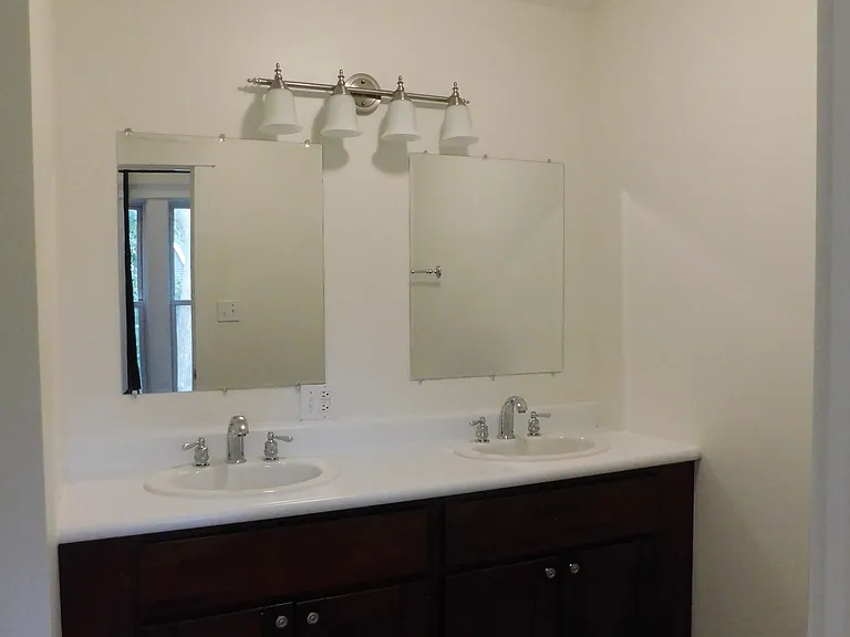 Main bathroom includes tub with shower and toilet.