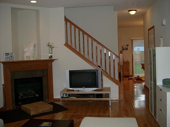 Living room with gas fireplace, cable access.
