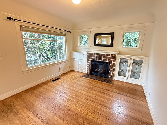 Living room with gas fireplace and built-ins