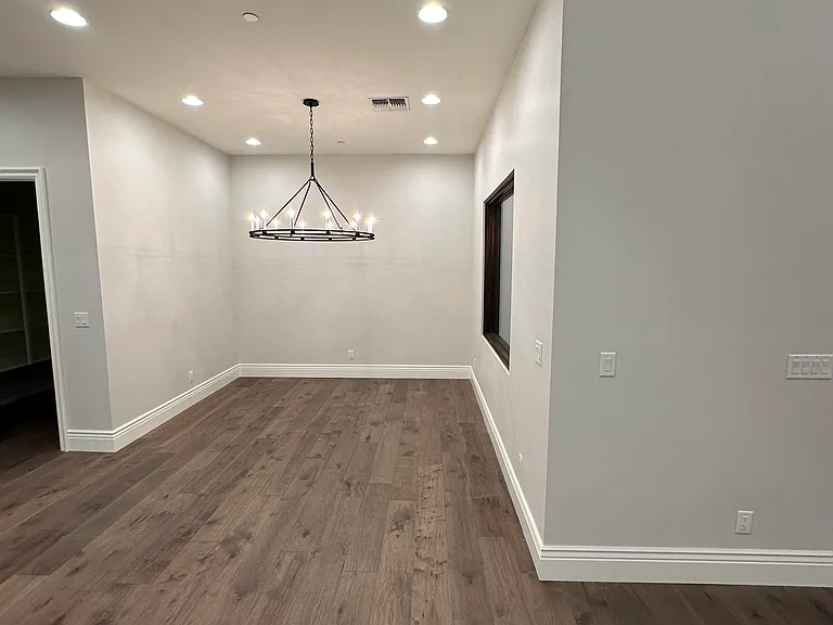 Dining nook off kitchen, showing entry to large walk-pantry