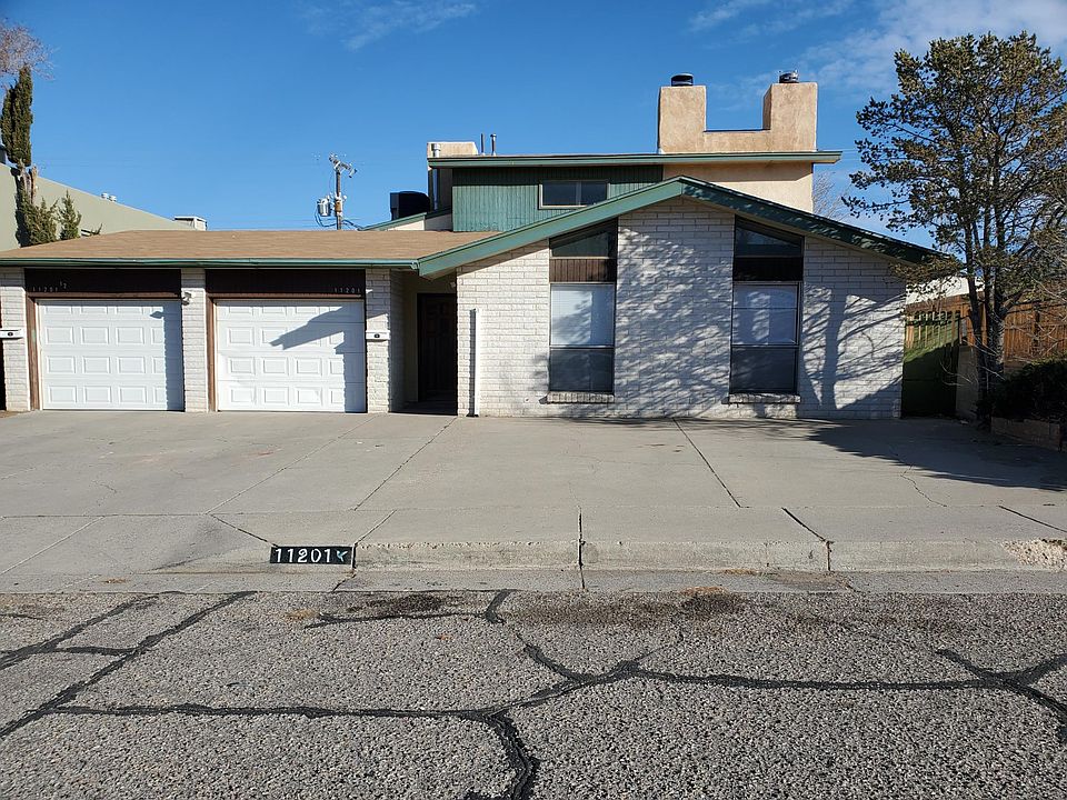 House Front. This duplex unit has the one-car garage and the 2-stories on the right