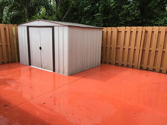 Nice fenced yard with shed