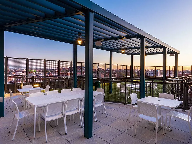 8th Floor Outdoor terrace with dining tables and seating