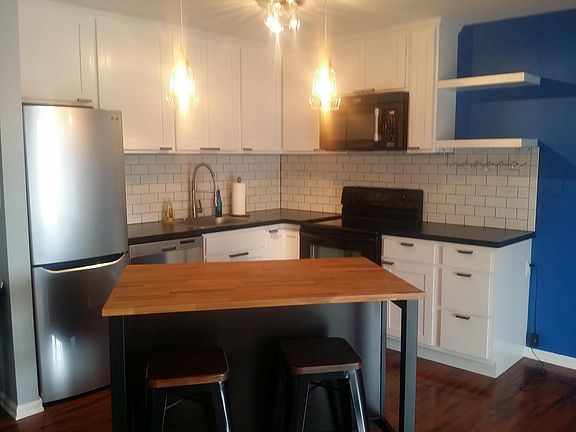 Beautiful Kitchen with Refrigerator, Stove, Microwave, & Dishwasher