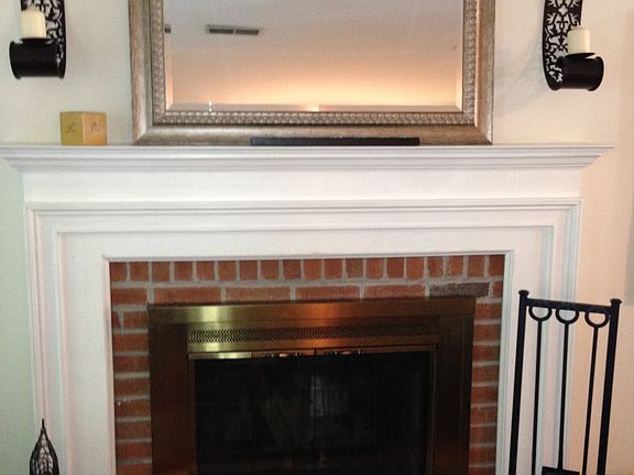 A detailed view of the brick fireplace with gas starter