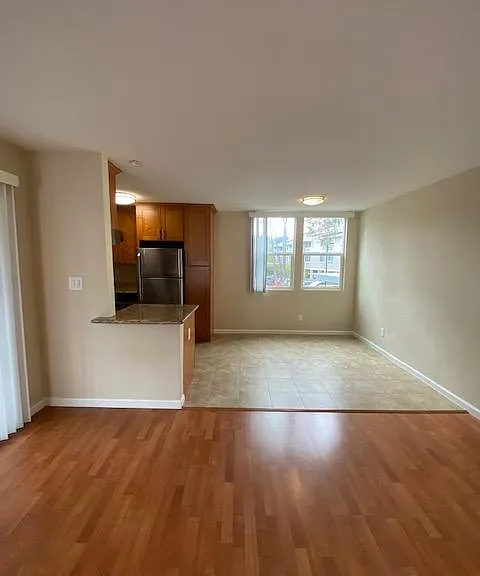 Living room with view into dining area and kitchen