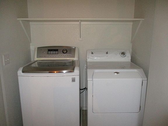 Upstairs laundry with washer and dryer