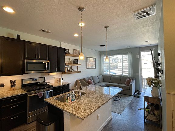 Open concept living room, kitchen, and dining room
