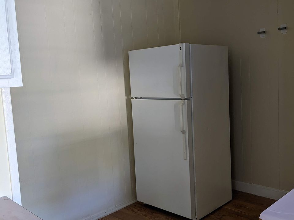Dining room with refrigerator