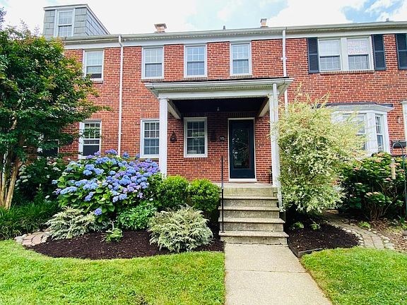 Front porch and flower beds with paver patio walkways