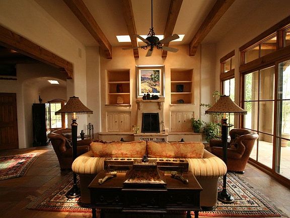 From the entry, directly in front of you, is the living room. The large windows and French doors pro