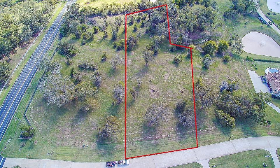 This large lot has a dry creek that runs at the back of property line.