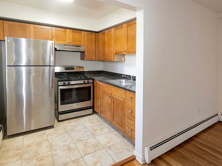 Elevate your lifestyle at Dorchester House Apartments with this modern kitchen featuring sleek stainless steel appliances and ample storage. Ideal for culinary enthusiasts and gatherings alike. Schedule a visit today to see it firsthand!