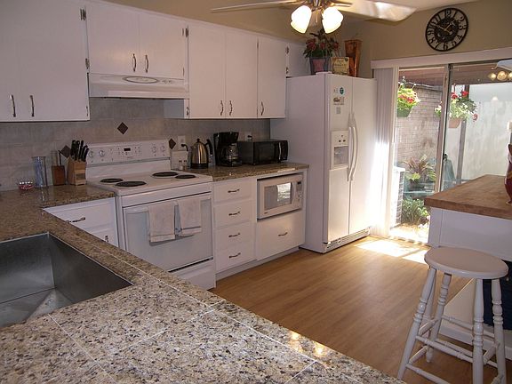Custom kitchen with granite and great sink and faucet.  Light and bright!