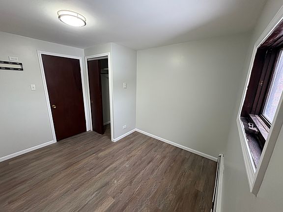 Primary bedroom - new flooring, lighting.