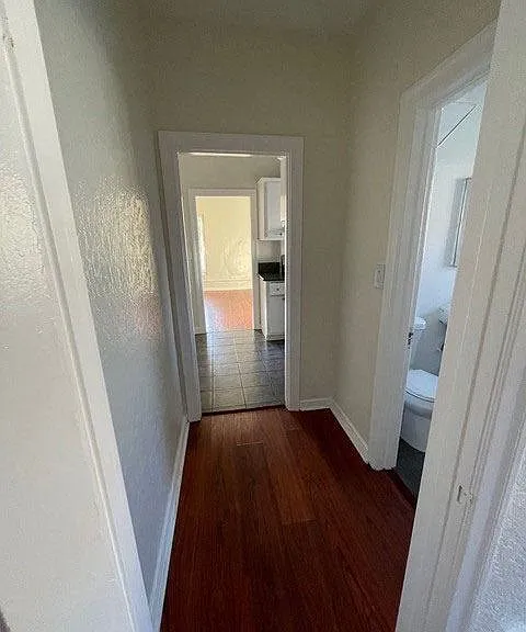 Hallway to bathroom and bedroom in apartment unit of Moliino Del Mar Apartments in Pasadena, California.